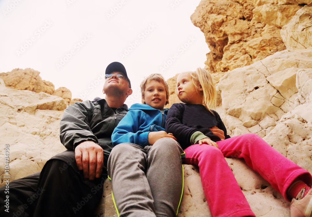 Portrait of happy father with two kids