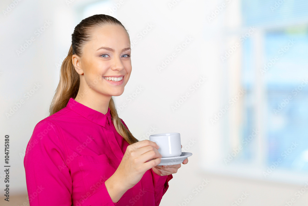 Beautiful and smiling woman with a cup of coffee Beautiful and smiling woman with a cup of coffee