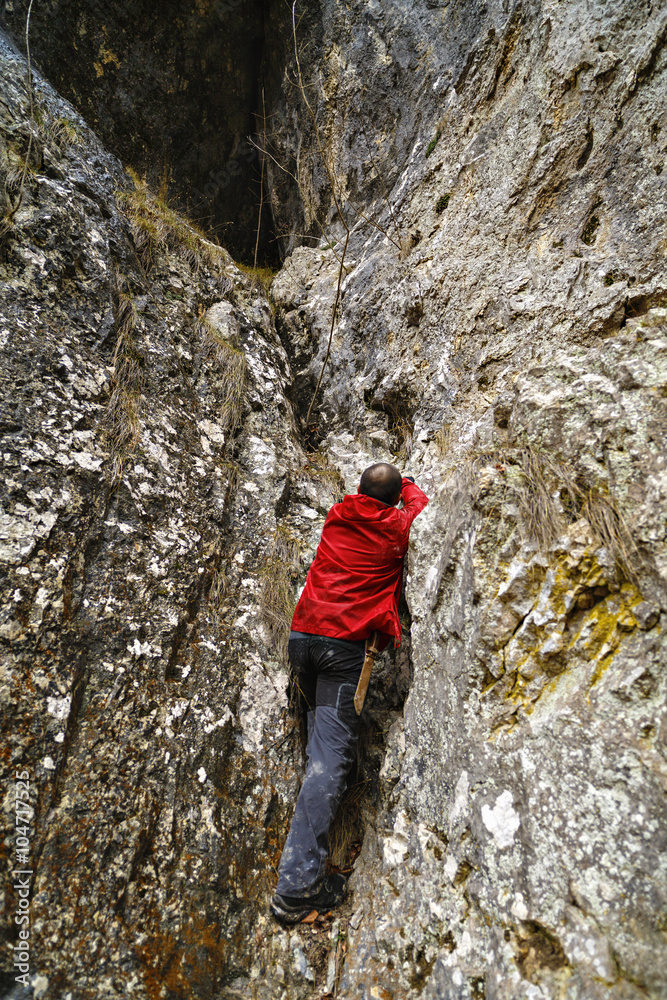 Caucasian man with backpack hiking into the mountains Caucasian man with backpack hiking into the mountains