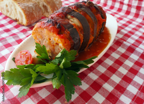 Turkich style baked aubergine, eggplant, with ground meat and tomatoes photo