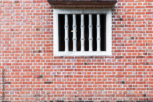 Old red brick wall with Window.