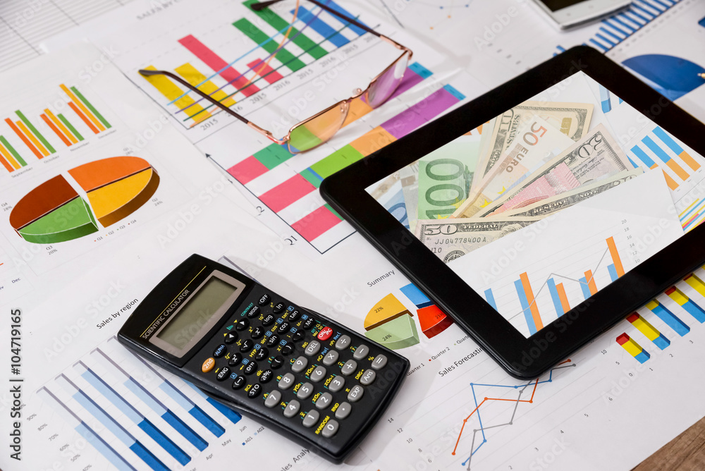 business workplace with digital tablet, mobile smartphone and some charts and graphs, pen business workplace with digital tablet, mobile smartphone and some charts and graphs, pen