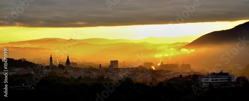 City sunrise over mountain