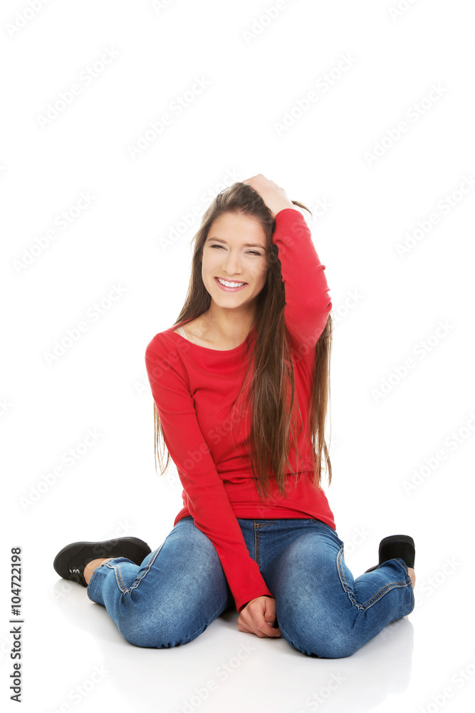 Relaxing woman sitting on the floor. Relaxing woman sitting on the floor.