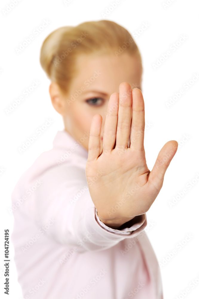 Young business woman shows stop gesture Young business woman shows stop gesture