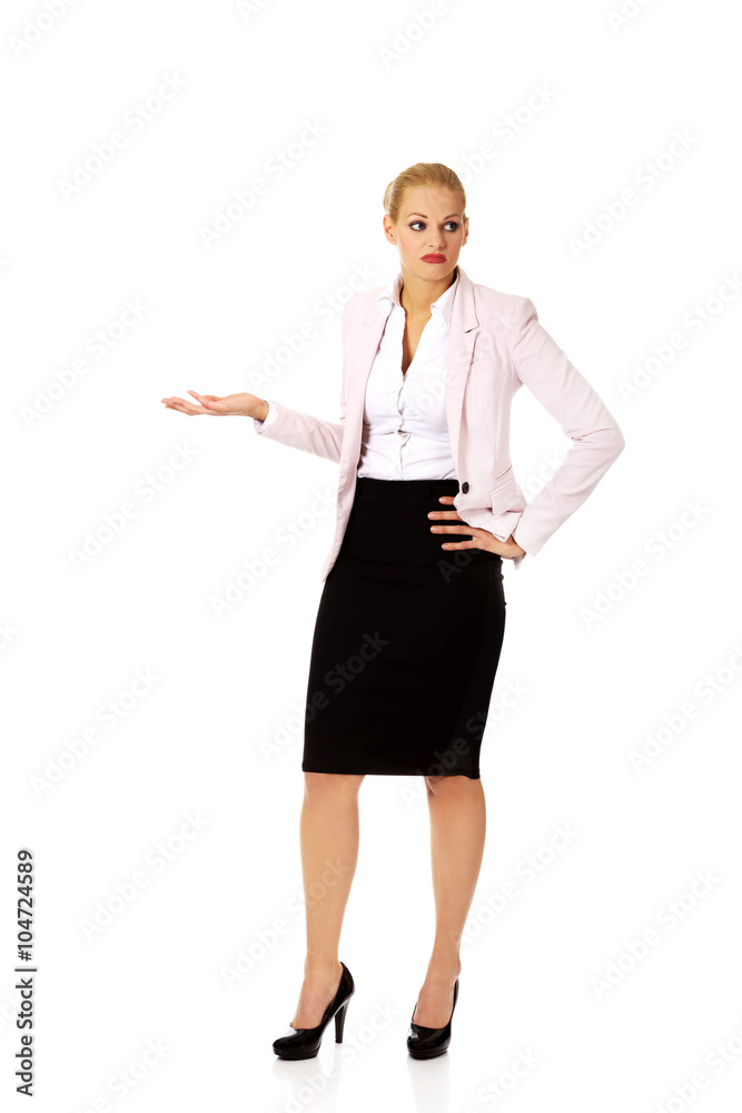 Young business woman shrugging with I dont know gesture Young business woman shrugging with I dont know gesture