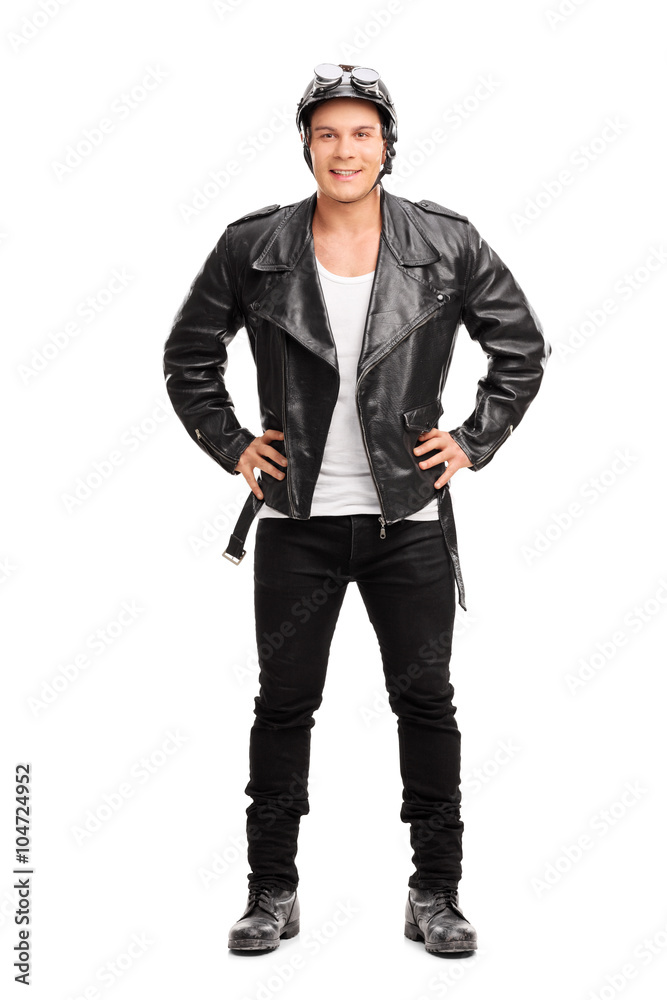 Young cheerful biker in a black leather jacket Young cheerful biker in a black leather jacket