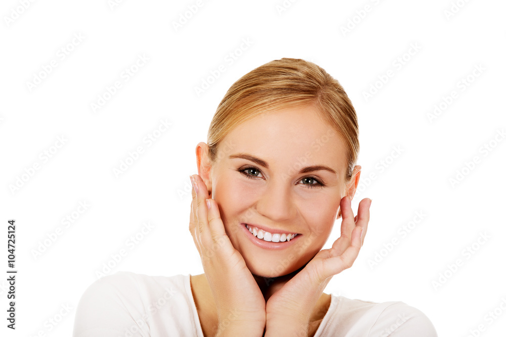 Young happy woman holding both hands on cheeks Young happy woman holding both hands on cheeks