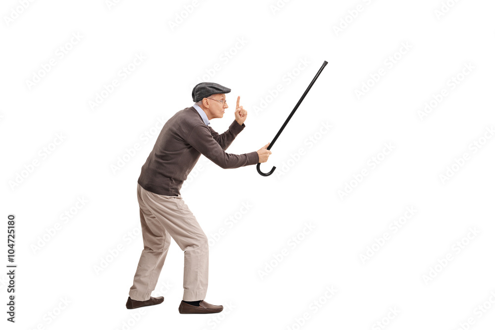Enraged senior holding his cane as a sword Enraged senior holding his cane as a sword