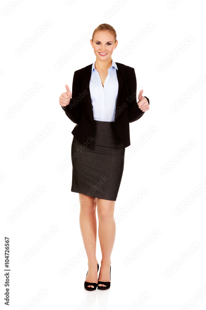 Young happy business woman with thumbs up Young happy business woman with thumbs up