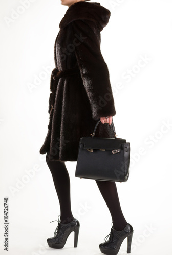 Brown mink furcoat and purse.