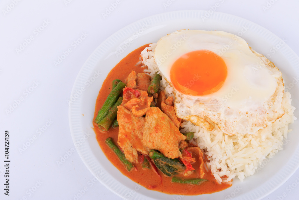 Fried pork curry, Stir fried pork and red curry paste with sunny side up egg (Moo Pad Prik Gaeng). Thai food.