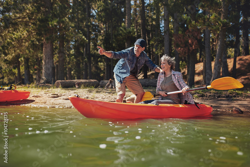 Senior couple on kayak in the lake