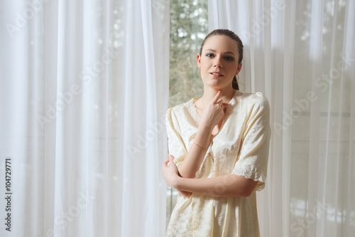 Free Download pretty young lady in silk peignoir near window - GFXLoad