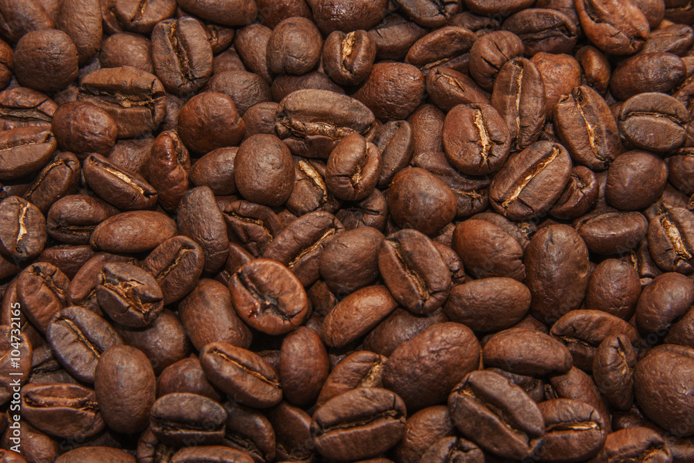 Naklejka premium Roasted coffee beans background