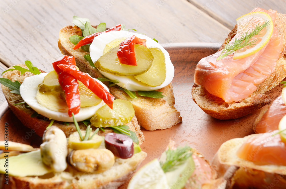 Open sandwiches with salmon, eggs and mussels