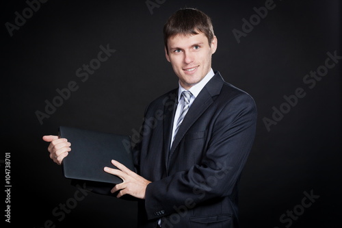 Foto Oleg, man in white shirt and gray suit with laptop