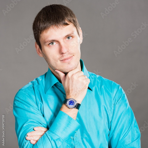 Fotografie Oleg, man in blue shirt  with wristwatch