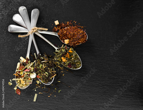 Flavoured and flower tea in metal spoon