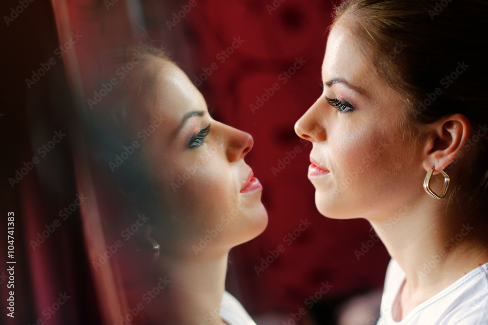 Fototapeta premium Beautiful bride getting professional makeup