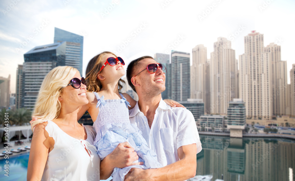 happy family over dubai city background happy family over dubai city background