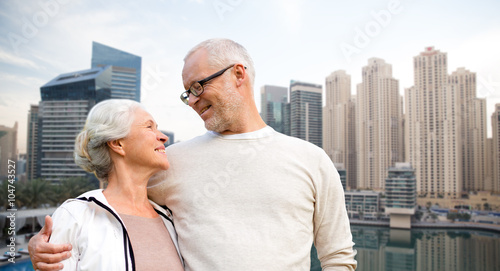 Photography senior couple hugging over dubai city waterfront