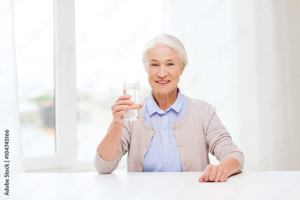 happy senior woman with glass of water at home happy senior woman with glass of water at home