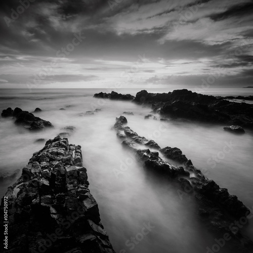 Fotografie Long exposure and black and white image of Rocky Beach