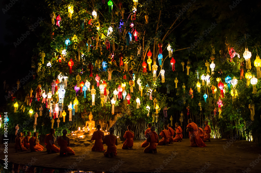 Buddhist monks sit meditating under a Bodhi Tree at the Wat Pan Tao temple November, 2015 in Chiang mai, Thailand.
