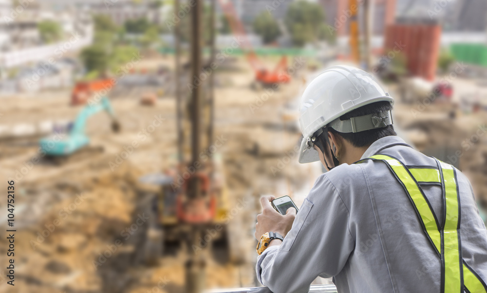 an engineer monitor a construction site