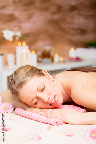 Vertical image of beautiful woman relaxing at spa treatment