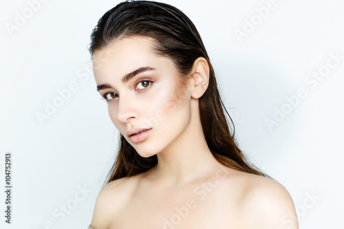Beautiful Young Woman with Clean Fresh Skin close up isolated on white. Beauty Girl Portrait. Spa Woman Smiling. Perfect Fresh Skin. Face Model. Youth and Skin Care Concept