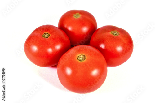 Four red tomatoes macro or close up isolated on white background
