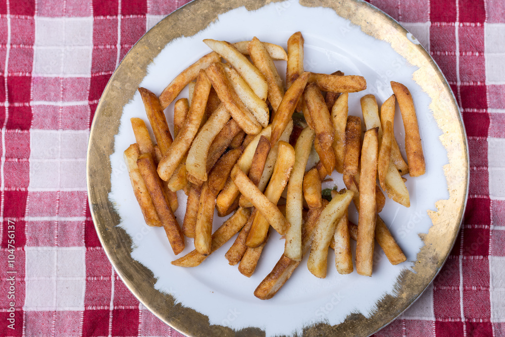 Top view of plate with fresh fryed french fries Top view of plate with fresh fryed french fries