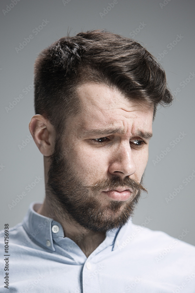 Close up face of discouraged man Close up face of discouraged man