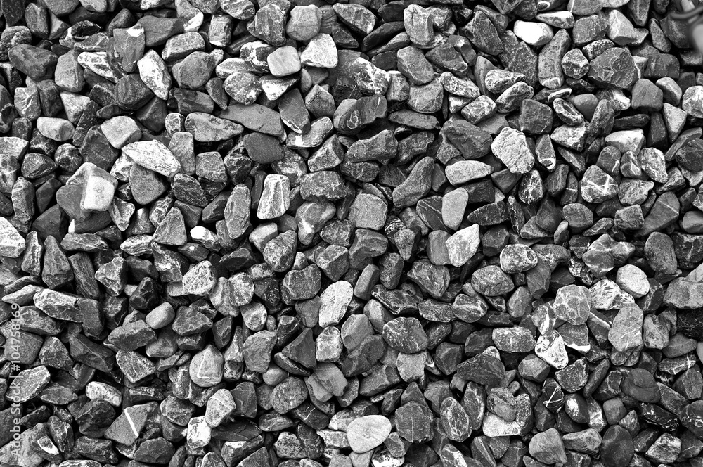 Pattern grey gravel granite texture background for mix rock concrete pattern in construction industrial. Small gray pebble on ground or floor. Vintage and retro. Black and white color. Close up. Pattern grey gravel granite texture background for mix rock concrete pattern in construction industrial. Small gray pebble on ground or floor. Vintage and retro. Black and white color. Close up.