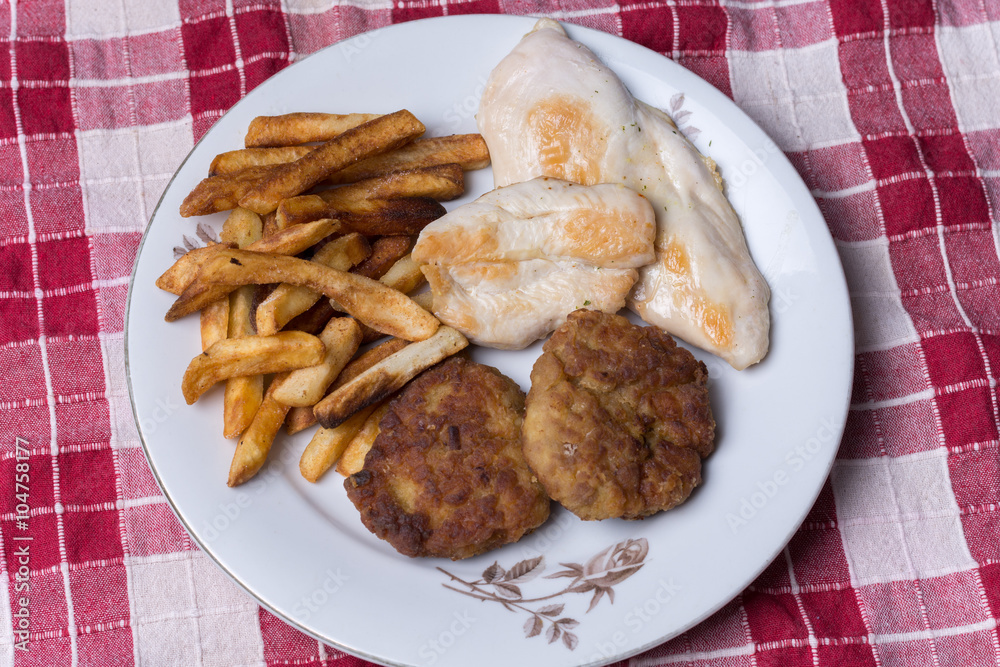 Served chichen meat beef meatballs and french fries Served chichen meat beef meatballs and french fries