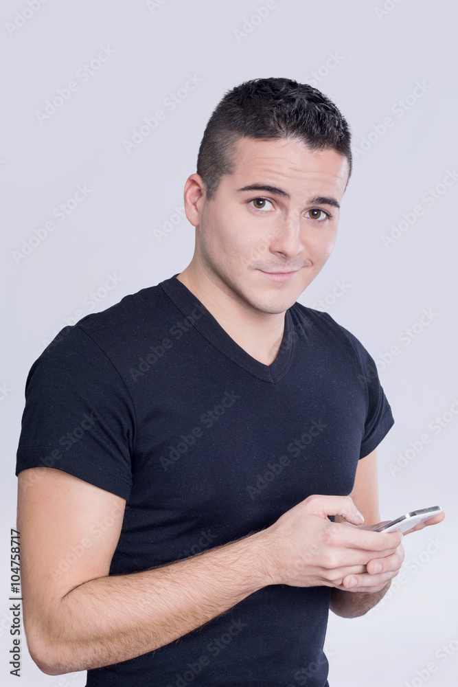 Man typing on his cell phone Man typing on his cell phone