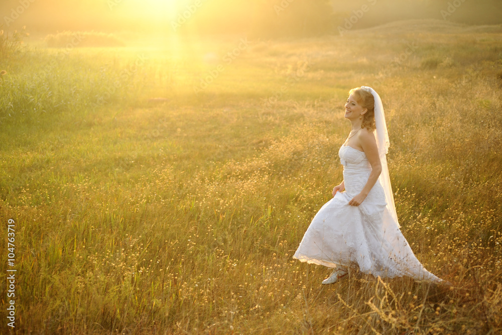 Bride Posing in the Sunlit Field Bride Posing in the Sunlit Field