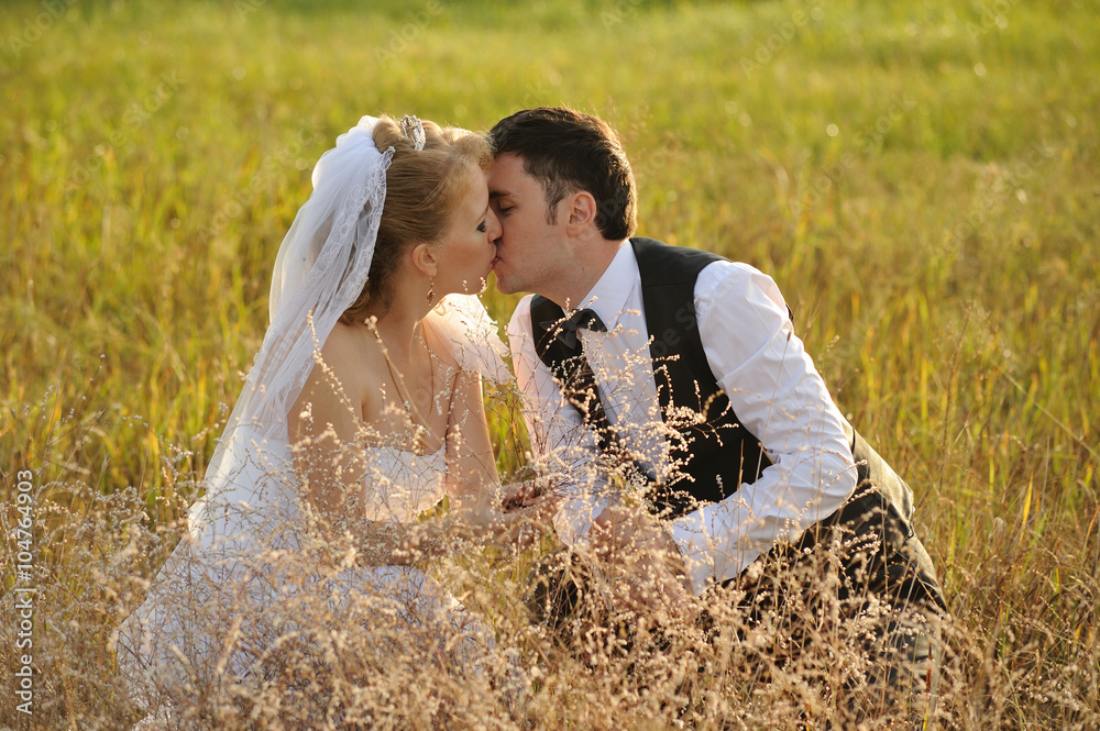 Bride and Groom Posing in the field