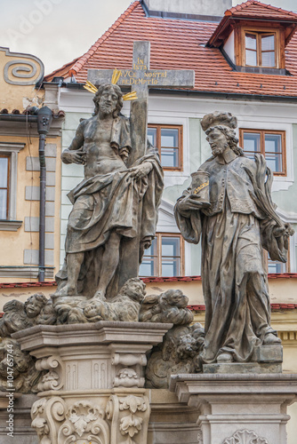 Statue of the Holy Savior with Cosmas and Damian on Charles Bridge in Prague, Czech