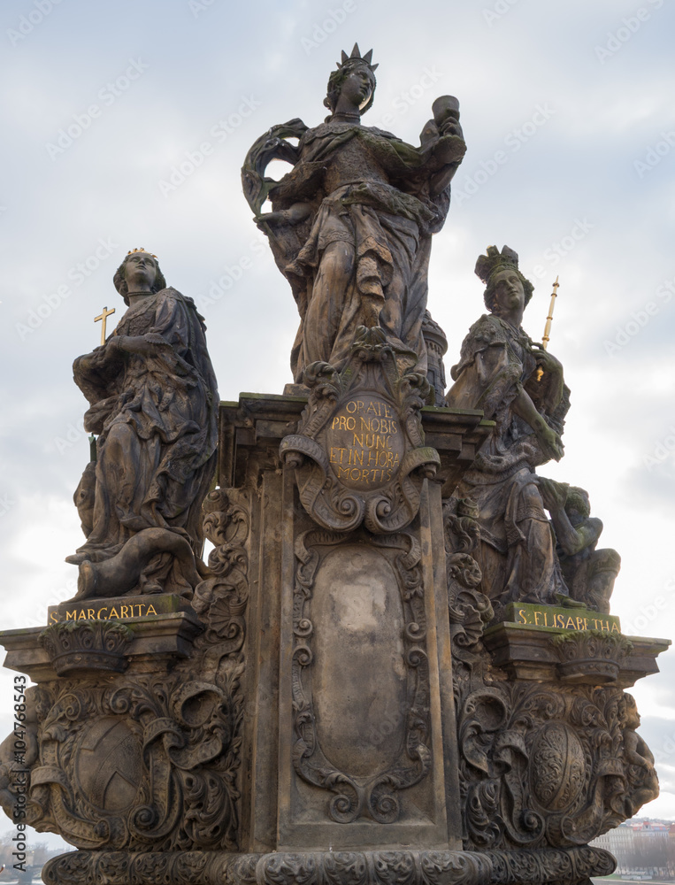 Statues St. Barbara, St. Margaret and St. Elizabeth on the Charles Bridge in Prague, Czech Republic