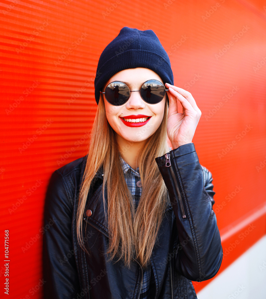 Portrait smiling blonde woman wearing fashion rock black style o Portrait smiling blonde woman wearing fashion rock black style o
