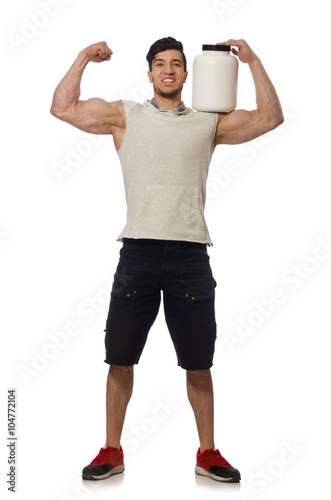 Muscular man with protein jars on white