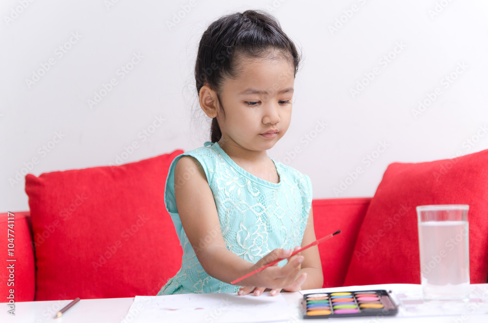 Asian little girl playing playing water color, drawing Asian little girl playing playing water color, drawing