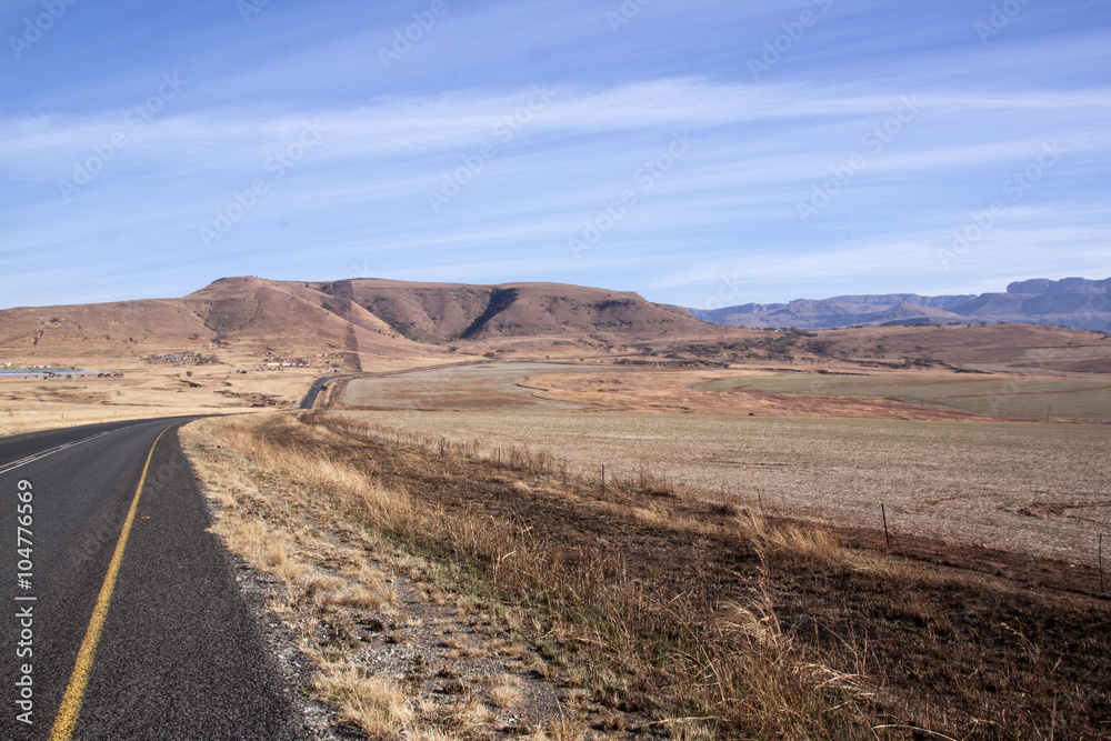 Asphalt Road Stretching Through Arid Dry Winter Landscape