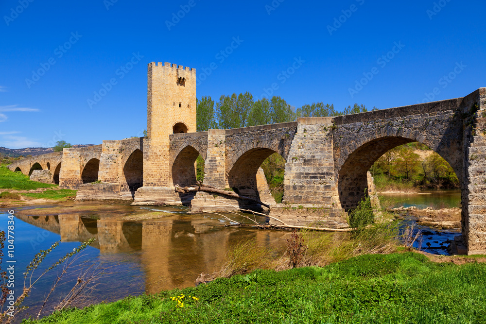Medieval stone bridge over Ebro river in Frias, historic village in the province of Burgos, Spain