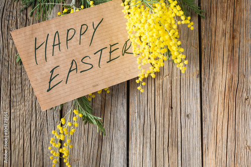 message happy easter on wood table photo