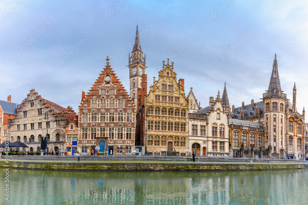 Picturesque panorama with medieval building and Clock Tower on the quay Graslei at Ghent town, Belgium