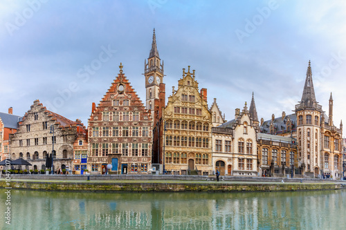 Picturesque panorama with medieval building and Clock Tower on the quay Graslei at Ghent town, Belgium